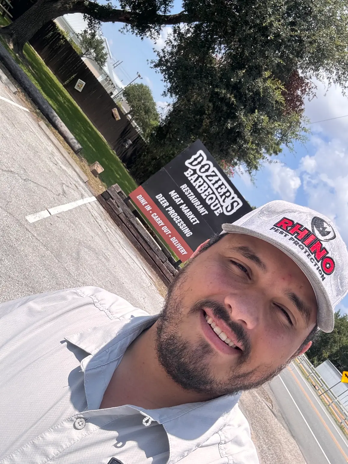 Rhino Pest Protection technician outside Dozier's Barbeque in Fulshear, TX